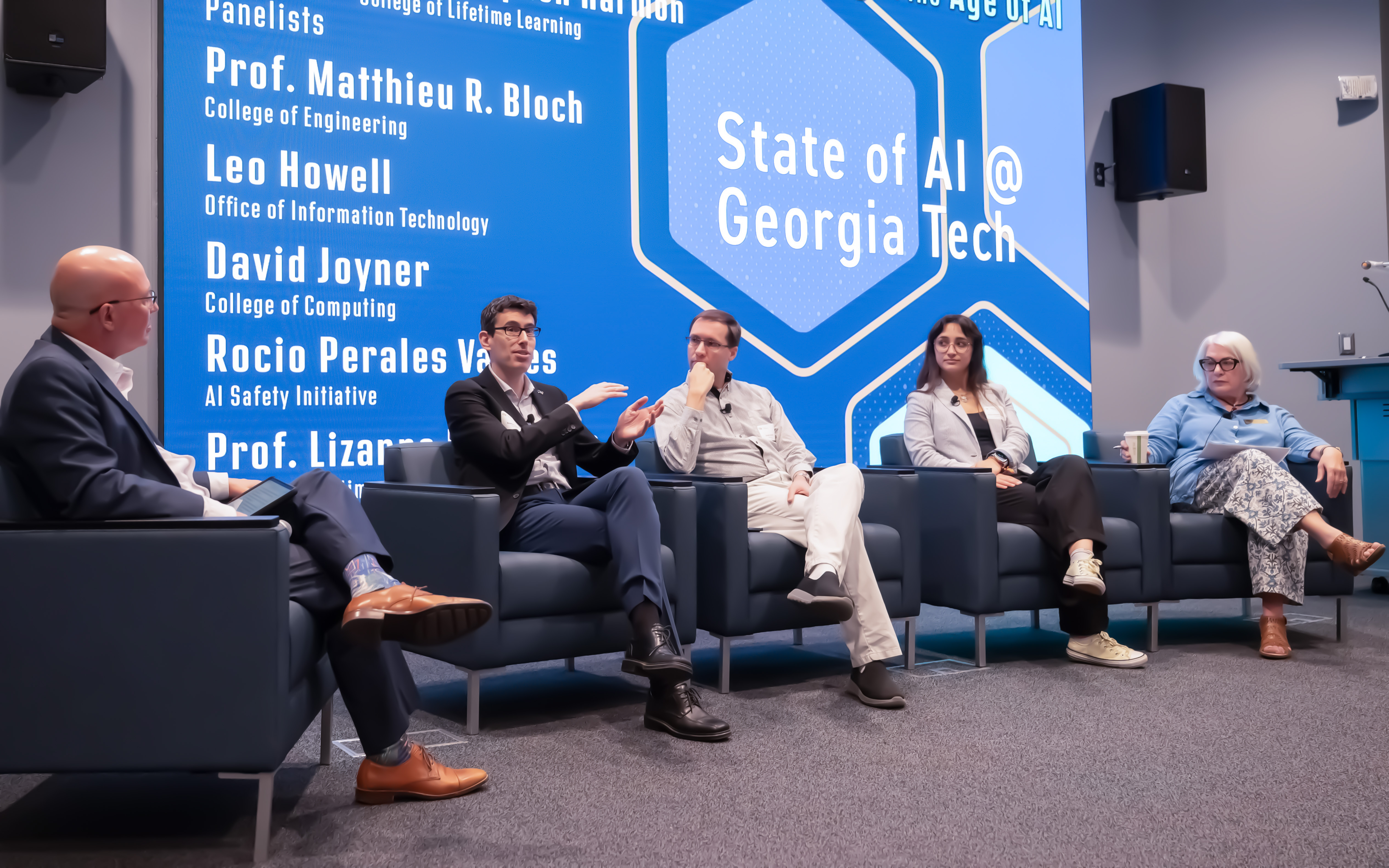 Harmon, Bloch, Joyner, Perales Valdes, and DeStefanno during the panel presentation.